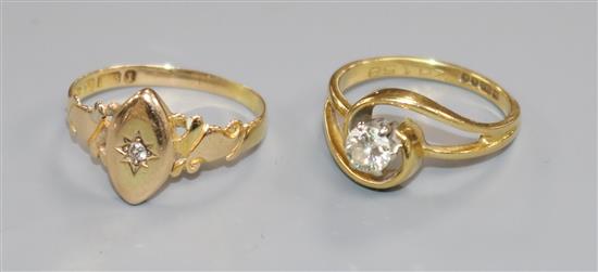 A late Victorian 15ct gold and diamond set ring and a later 18ct gold and diamond ring,